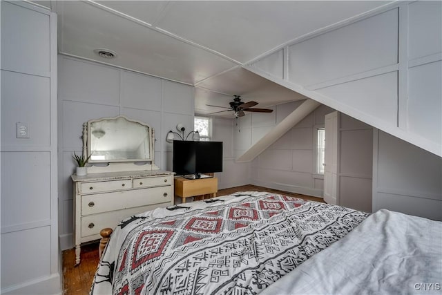 bedroom featuring ceiling fan and dark hardwood / wood-style floors