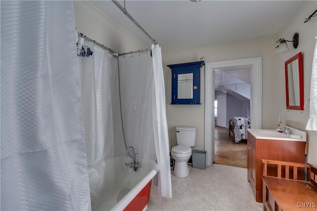 full bathroom featuring toilet, vanity, and shower / bath combo with shower curtain