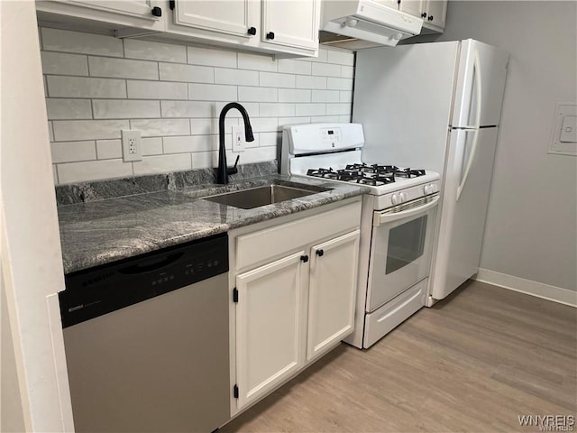 kitchen with sink, light wood-type flooring, stainless steel dishwasher, white range with gas cooktop, and white cabinets