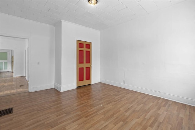 empty room with wood-type flooring