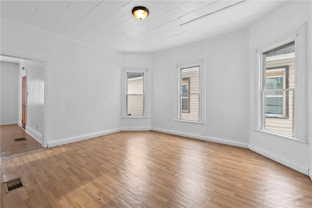 spare room featuring light hardwood / wood-style floors