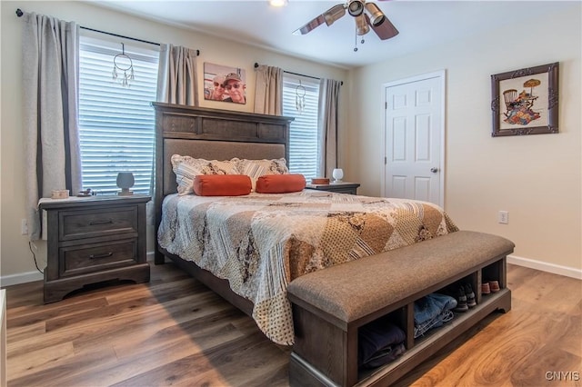 bedroom featuring hardwood / wood-style floors and ceiling fan