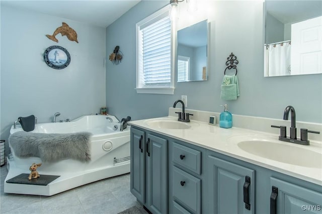 bathroom featuring vanity, a bathing tub, and tile patterned flooring