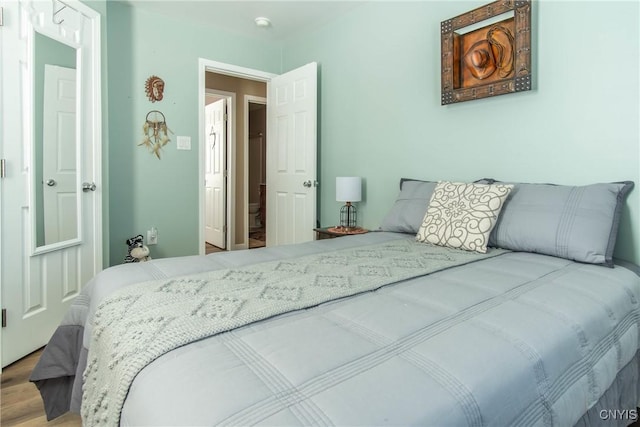 bedroom featuring hardwood / wood-style floors