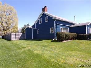 view of home's exterior with a yard