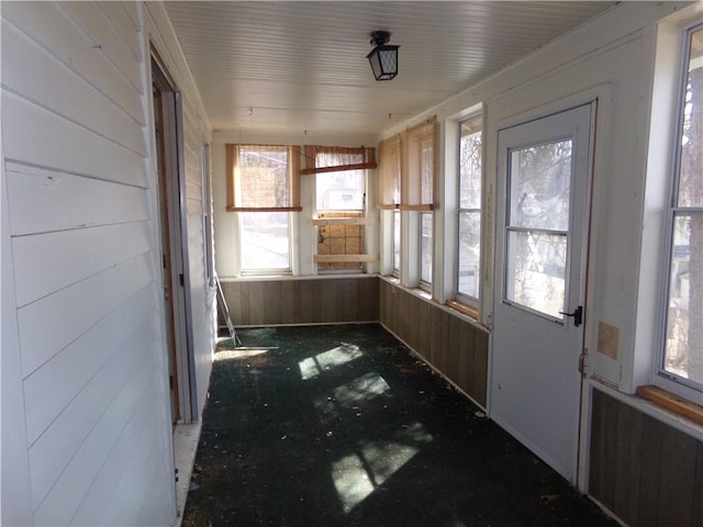 unfurnished sunroom with plenty of natural light