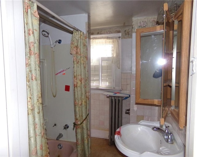 full bathroom with radiator, tile walls, and shower / bath combo with shower curtain