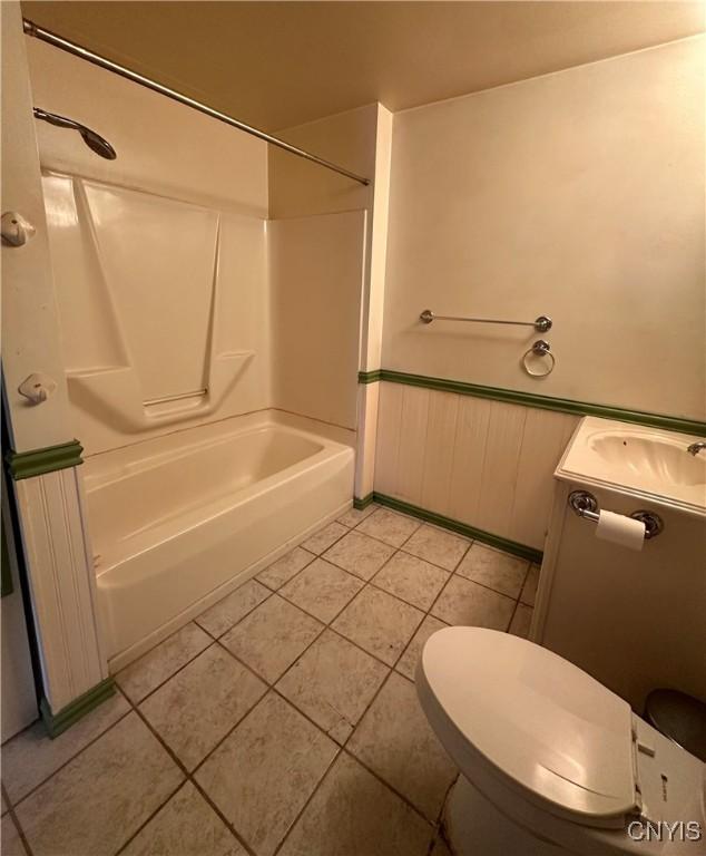 32458 County Route 54, Clayton, NY 13632 - full bathroom featuring vanity, tile patterned floors, shower / bathtub combination, and toilet