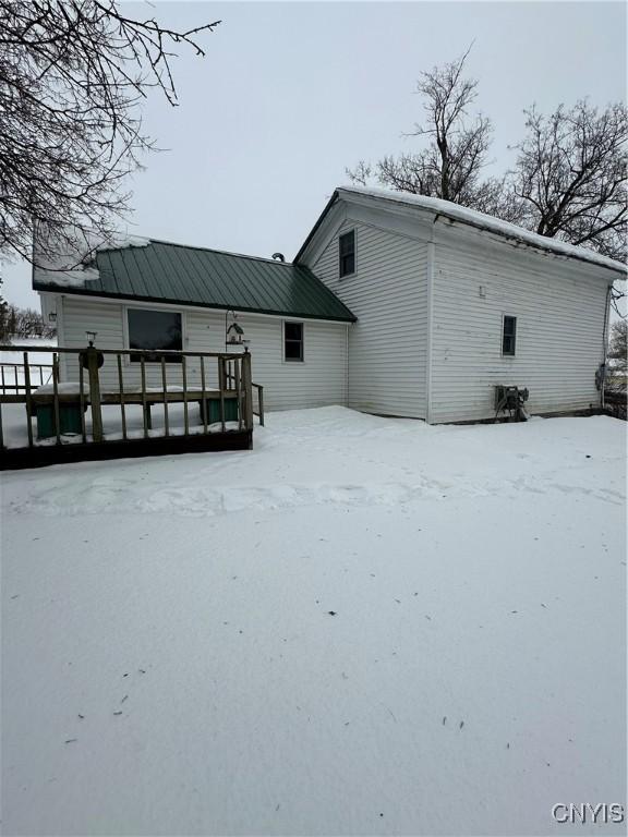 32458 County Route 54, Clayton, NY 13632 - snow covered back of property with a deck