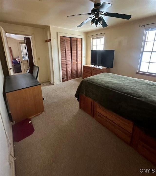 32458 County Route 54, Clayton, NY 13632 - carpeted bedroom featuring multiple windows, a closet, and ceiling fan