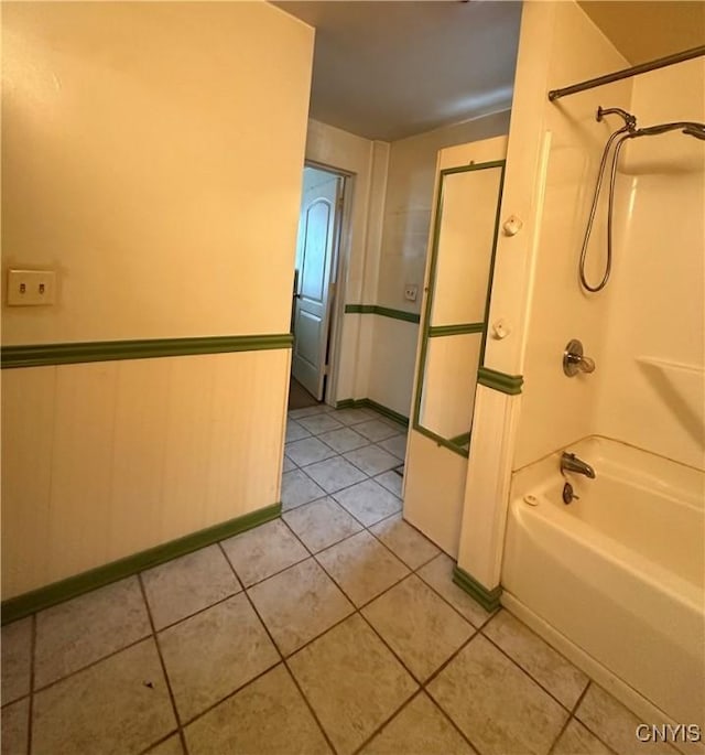 32458 County Route 54, Clayton, NY 13632 - bathroom featuring tile patterned flooring and washtub / shower combination