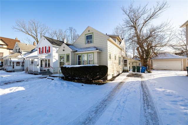 view of front of property featuring a garage and an outdoor structure