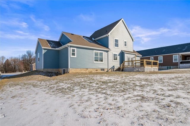 back of property featuring a wooden deck