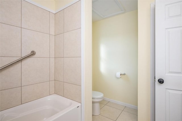 bathroom with toilet and tile patterned flooring