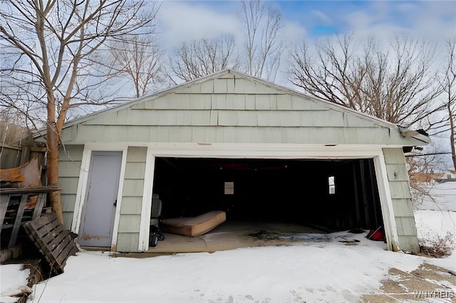 view of snow covered garage