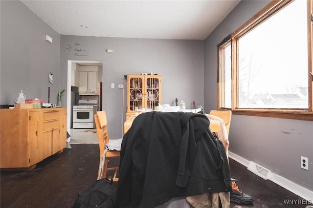 dining room featuring dark hardwood / wood-style flooring