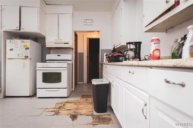 kitchen featuring white appliances and white cabinets