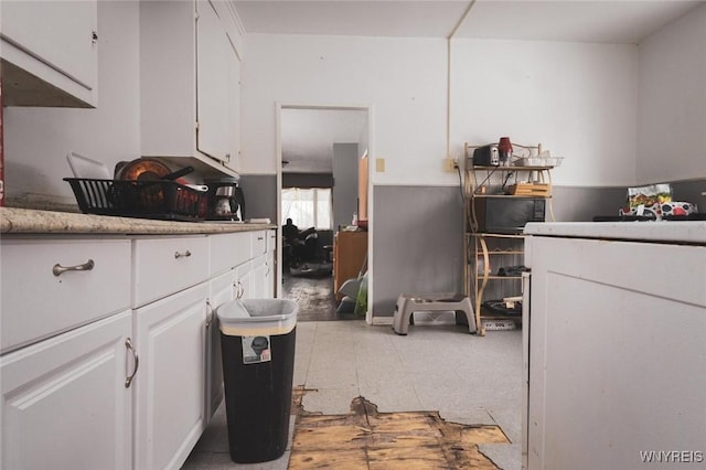 kitchen featuring white cabinetry