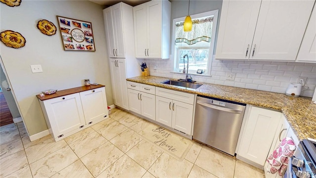 kitchen with sink, decorative light fixtures, dishwasher, light stone countertops, and white cabinets