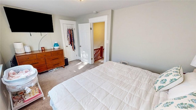 carpeted bedroom featuring a closet