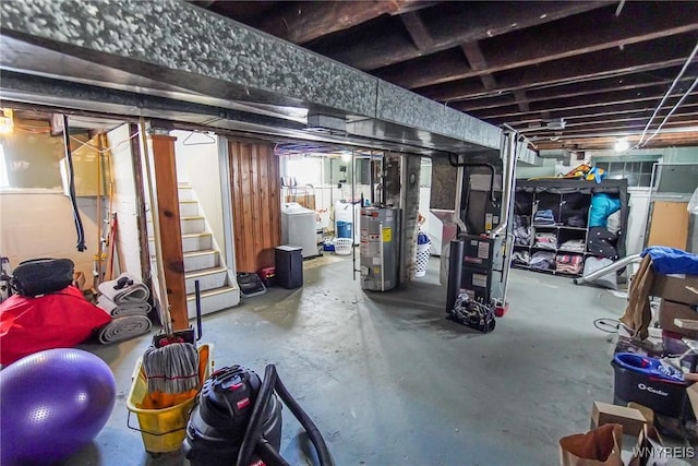 basement with washer / dryer, heating unit, and gas water heater