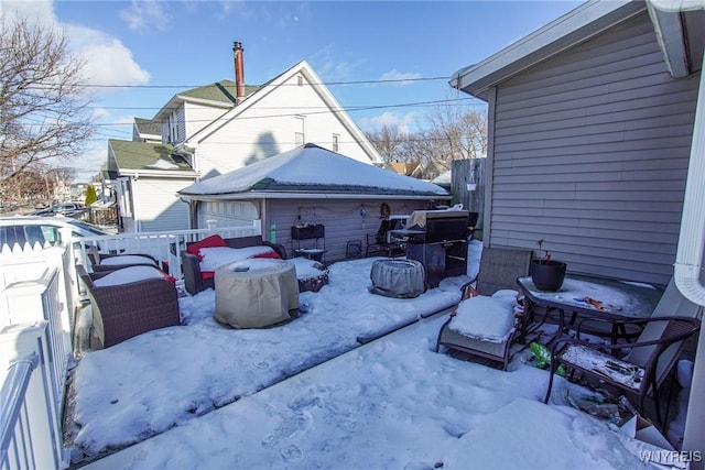 view of snow covered patio