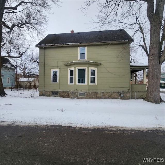 view of snow covered house