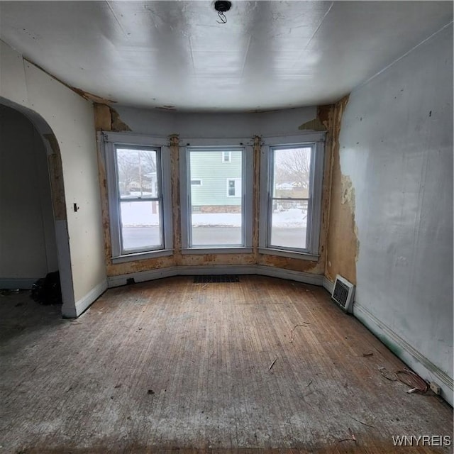 unfurnished room featuring hardwood / wood-style floors