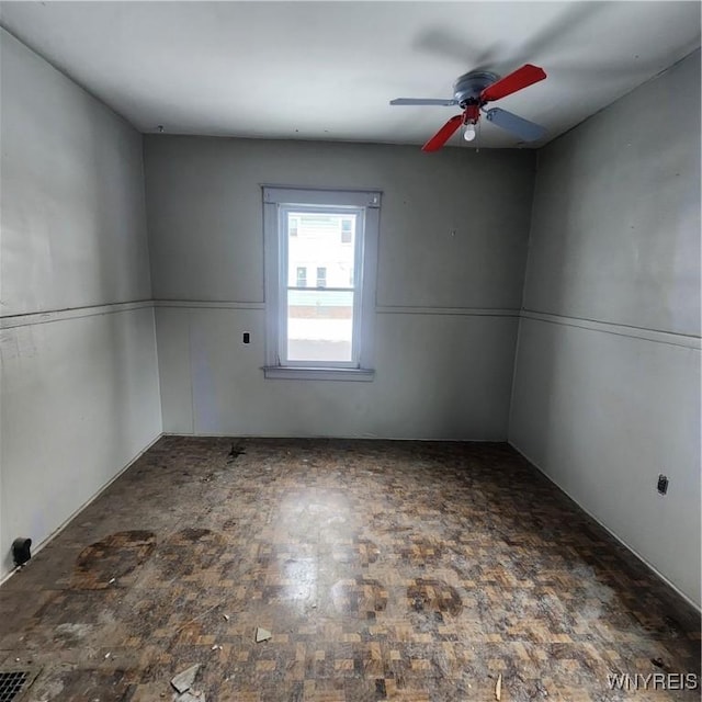 unfurnished room with ceiling fan