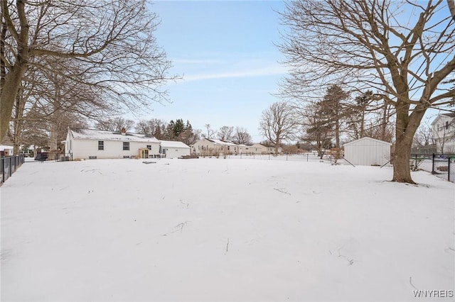 view of yard layered in snow