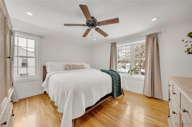 bedroom featuring ceiling fan and light hardwood / wood-style floors