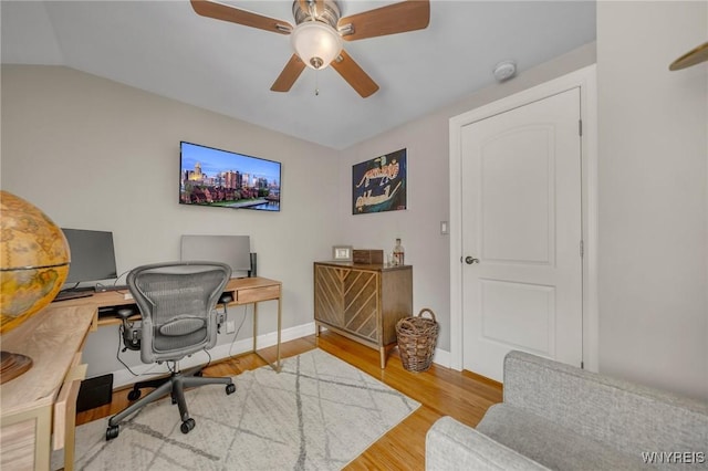 office space with ceiling fan, lofted ceiling, and light wood-type flooring