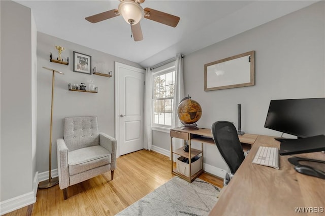 home office with ceiling fan and light wood-type flooring