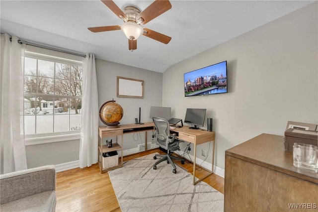 office with ceiling fan and light hardwood / wood-style floors