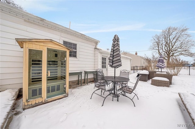 view of snow covered patio