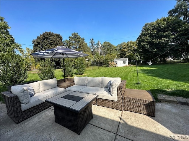 view of patio featuring an outdoor hangout area and an outbuilding