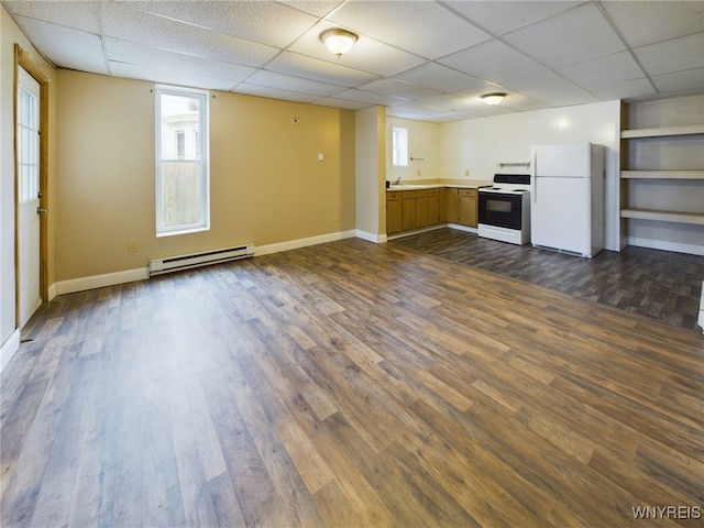 kitchen with white refrigerator, a baseboard radiator, electric range, and dark hardwood / wood-style flooring