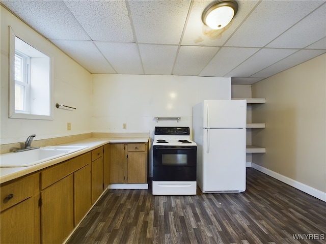 kitchen featuring white refrigerator, electric range oven, sink, and dark hardwood / wood-style floors