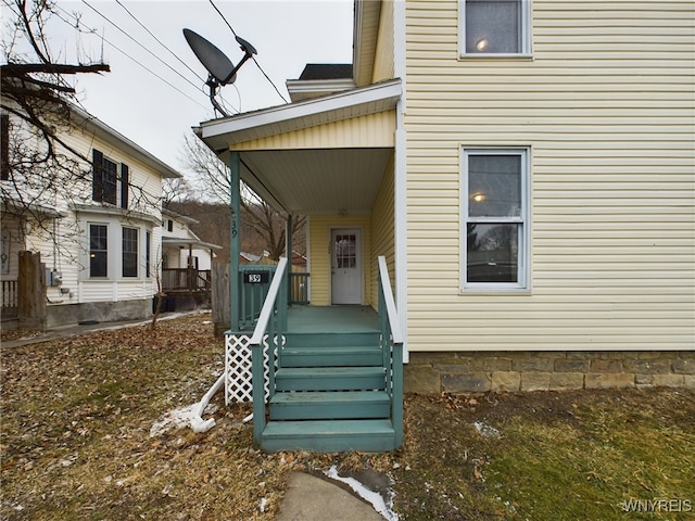 back of property featuring a porch