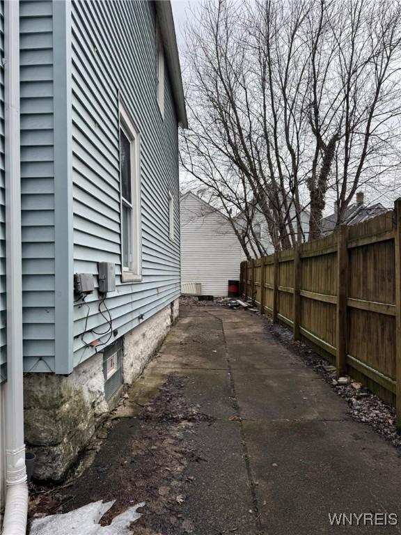 view of side of property with fence