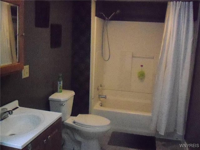 full bathroom featuring toilet, vanity, and shower / bath combo with shower curtain