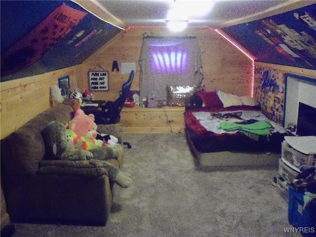 bedroom with vaulted ceiling and wood walls