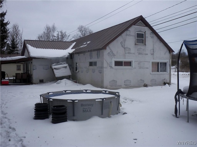 view of snow covered house