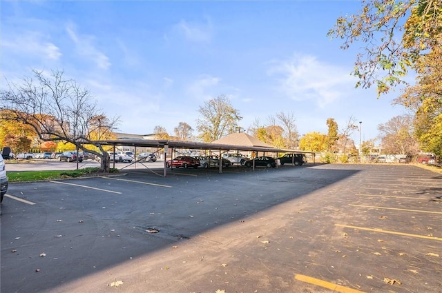 view of vehicle parking with a carport