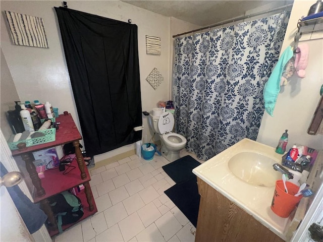 bathroom featuring vanity, a shower with curtain, and toilet