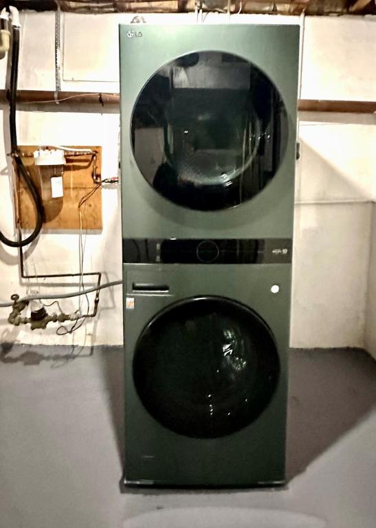 laundry room featuring stacked washer / dryer