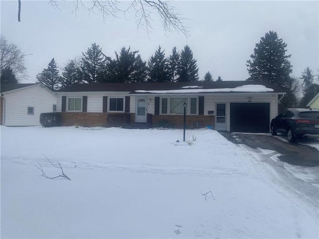 single story home featuring a garage