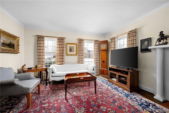 living room featuring dark hardwood / wood-style flooring, crown molding, and ornate columns