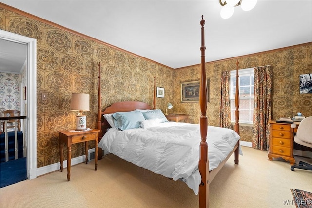 bedroom featuring crown molding and carpet