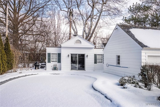 view of snow covered house